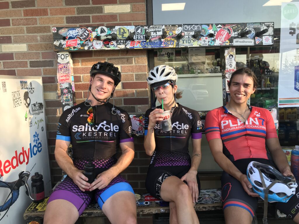 A group of cyclists sitting at the Big Cottonwood mouth 7-11.